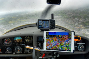 Picture of the cockpit of a touring motor glider Dimona H36 built 1983 over Bochum flying in a snow show, Ruhrgebiet, in the federal state North Rhine-Westphalia, Germany. Picture of the cockpit of a touring motor glider Dimona H36 built 1983 over Bochum flying in a snow show, Ruhrgebiet, in the federal state North Rhine-Westphalia, Germany.