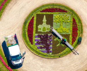 Aerial view of Schloss Berge with baroque garden and bed with city emblem of Gelsenkirchen with gardener who works in the flowerbed with the help of a ladder in Gelsenkirchen in the Ruhrgebiet in North Rhine-Westphalia in Germany, Gelsenkirchen, Ruhrgebiet, North Rhine-Westphalia, Germany Aerial view of Schloss Berge with baroque garden and bed with city emblem of Gelsenkirchen with gardener who works in the flowerbed with the help of a ladder in Gelsenkirchen in the Ruhrgebiet in North Rhine-Westphalia in Germany, Gelsenkirchen, Ruhrgebiet, North Rhine-Westphalia, Germany