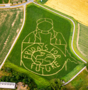 Aerial photograph of the FRIDAYS FOR FUTURE emblem with climate activist Greta Thunberg as corn maze on a field in Cappenberg, Selm, Ruhr area, North Rhine-Westphalia, Germany. The farmer Benedikt Lünemann from Cappenberg near Dortmund realized for the tenth time socially relevant topics on his maize field. He mowed more than 15 hours to create this walk-in 2.5 hectare work of art. Photo: Aerial photograph Hans Blossey, Germany, climate activist Greta Thunberg, the movement Fridays for Future, maize field, maize labyrinth, climate crisis, climate catastrophe, agriculture, maize labyrinth, Cappenberg, emblem FRIDAYS For FUTURE Aerial photograph of the FRIDAYS FOR FUTURE emblem with climate activist Greta Thunberg as corn maze on a field in Cappenberg, Selm, Ruhr area, North Rhine-Westphalia, Germany. The farmer Benedikt Lünemann from Cappenberg near Dortmund realized for the tenth time socially relevant topics on his maize field. He mowed more than 15 hours to create this walk-in 2.5 hectare work of art. Photo: Aerial photograph Hans Blossey, Germany, climate activist Greta Thunberg, the movement Fridays for Future, maize field, maize labyrinth, climate crisis, climate catastrophe, agriculture, maize labyrinth, Cappenberg, emblem FRIDAYS For FUTURE