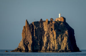 Strombolicchio, the tower-like cliff in front of the Stromboli volcano with lighthouse, Lipari, Aeolian Islands, Aeolian Islands, Tyrrhenian Sea, Southern Italy, Europe, Sicily, Italy Strombolicchio, the tower-like cliff in front of the Stromboli volcano with lighthouse, Lipari, Aeolian Islands, Aeolian Islands, Tyrrhenian Sea, Southern Italy, Europe, Sicily, Italy