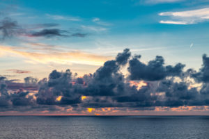 Sunset with storm clouds and purple clouds, near Reunion Island, France, Africa, Indian Ocean Sunset with storm clouds and purple clouds, near Reunion Island, France, Africa, Indian Ocean