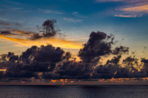 Sunset with storm clouds and purple clouds, near Reunion Island, France, Africa, Indian Ocean Sunset with storm clouds and purple clouds, near Reunion Island, France, Africa, Indian Ocean
