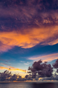 Sunset with storm clouds and purple clouds, near Reunion Island, France, Africa, Indian Ocean Sunset with storm clouds and purple clouds, near Reunion Island, France, Africa, Indian Ocean