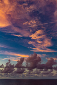 Sunset with storm clouds and purple clouds, near Reunion Island, France, Africa, Indian Ocean Sunset with storm clouds and purple clouds, near Reunion Island, France, Africa, Indian Ocean