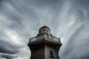 Wooden lighthouse in front of dramatic cloud front, Akaroa, Banks Peninsula, New Zealand Wooden lighthouse in front of dramatic cloud front, Akaroa, Banks Peninsula, New Zealand