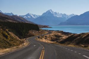 Curved road on Lake Pukaki with Mt Cook in the background, Canterbury, New Zealand Curved road on Lake Pukaki with Mt Cook in the background, Canterbury, New Zealand