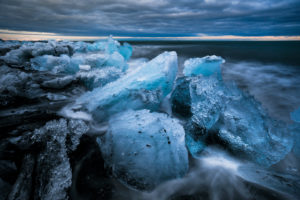 Chunks of ice in the surf at Diamond Beach, Jökulsárlón, Austurland, Iceland Chunks of ice in the surf at Diamond Beach, Jökulsárlón, Austurland, Iceland