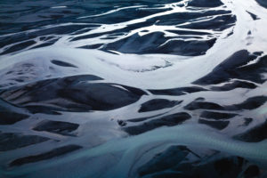 Aerial view of a branched stream in black sand, Sudurland, Iceland Aerial view of a branched stream in black sand, Sudurland, Iceland