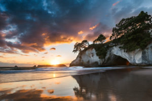 Cathedral Cove with reflection at sunrise, Coromandel Peninsula, New Zealand Cathedral Cove with reflection at sunrise, Coromandel Peninsula, New Zealand