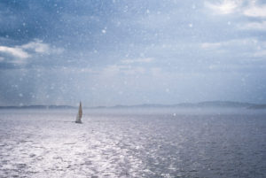 Single sailboat on the Lysefjord in the rain, Rogaland, Norway Single sailboat on the Lysefjord in the rain, Rogaland, Norway