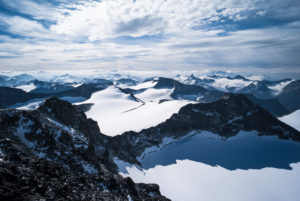 View from Galdhøpiggen over the snowy peaks of Jotunheimen, Norway View from Galdhøpiggen over the snowy peaks of Jotunheimen, Norway
