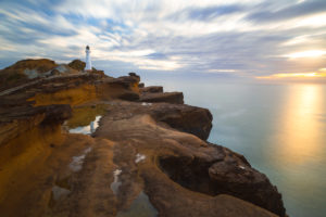 Long exposure of Castlepoint lighthouse at sunrise, Castlepoint, Wellington, New Zealand Long exposure of Castlepoint lighthouse at sunrise, Castlepoint, Wellington, New Zealand