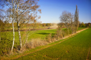 Agriculture, agriculture, tractor plows a field, Feldrain, blue sky,