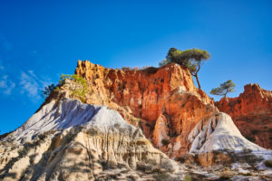 Europe, Portugal, Algarve, Litoral, Barlavento, district of Faro, between Vilamoura and Albufeira, Olhos de Agua, massif of colored layers of rock Europe, Portugal, Algarve, Litoral, Barlavento, district of Faro, between Vilamoura and Albufeira, Olhos de Agua, massif of colored layers of rock