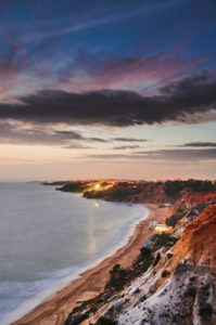 Europe, Portugal, Algarve, Litoral, Barlavento, District Faro, between Vilamoura and Albufeira, Olhos de Agua, sunset on the cliff, portrait format Europe, Portugal, Algarve, Litoral, Barlavento, District Faro, between Vilamoura and Albufeira, Olhos de Agua, sunset on the cliff, portrait format