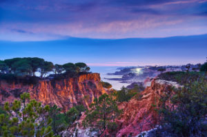 Europe, Portugal, Algarve, Litoral, Barlavento, Faro district, between Vilamoura and Albufeira, Olhos de Agua, sunset in a gorge on the cliffs Europe, Portugal, Algarve, Litoral, Barlavento, Faro district, between Vilamoura and Albufeira, Olhos de Agua, sunset in a gorge on the cliffs
