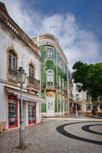 Europe, Portugal, Algarve, Litoral, Barlavento, Felsalgarve, Faro District, Lagos, Praca Luis de Camoes, corner house with green azulejos, Obrigado shop, portrait format Europe, Portugal, Algarve, Litoral, Barlavento, Felsalgarve, Faro District, Lagos, Praca Luis de Camoes, corner house with green azulejos, Obrigado shop, portrait format