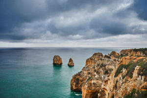 Europe, Portugal, Algarve, Litoral, Barlavento, Felsalgarve, Faro District, Lagos, coastline of the Ponta da Piedade, with offshore rock reef, overcast with clouds Europe, Portugal, Algarve, Litoral, Barlavento, Felsalgarve, Faro District, Lagos, coastline of the Ponta da Piedade, with offshore rock reef, overcast with clouds