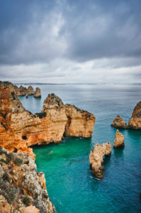 Europe, Portugal, Algarve, Litoral, Barlavento, Felsalgarve, district Faro, Lagos, Ponta da Piedade, lagoon with reef and distant view, cloud formations, portrait format Europe, Portugal, Algarve, Litoral, Barlavento, Felsalgarve, district Faro, Lagos, Ponta da Piedade, lagoon with reef and distant view, cloud formations, portrait format