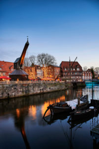 City view, Lüneburg, old town, water district, Am Stintmarkt, Am Fischmarkt, The Old Crane, landmark, illuminated, Christmas, Christmas market, night shot, portrait format City view, Lüneburg, old town, water district, Am Stintmarkt, Am Fischmarkt, The Old Crane, landmark, illuminated, Christmas, Christmas market, night shot, portrait format