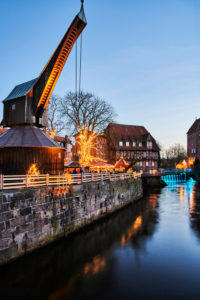 City view, Lüneburg, old town, water district, landmark, illuminated, old crane, Am Stintmarkt, Am Fischmarkt, Christmas, Christmas market, night shot, portrait format City view, Lüneburg, old town, water district, landmark, illuminated, old crane, Am Stintmarkt, Am Fischmarkt, Christmas, Christmas market, night shot, portrait format