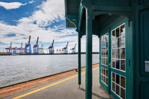 Germany, Northern Germany, Hamburg, Altona, Othmarschen, port city, seaport, the Elbe, museum harbor Oevelgönne, contrast old and new, historical Döns bus shelter on the pontoon, view to Container Terminal Burchardkai, Neumühlen ferry terminal Germany, Northern Germany, Hamburg, Altona, Othmarschen, port city, seaport, the Elbe, museum harbor Oevelgönne, contrast old and new, historical Döns bus shelter on the pontoon, view to Container Terminal Burchardkai, Neumühlen ferry terminal