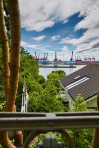 Germany, Northern Germany, Hamburg, Altona, Othmarschen, port city, seaport, Elbe, view from Elbchaussee over treetops and house roofs, harbor basin with container terminal in Waltershof, Burchardkai, portrait format Germany, Northern Germany, Hamburg, Altona, Othmarschen, port city, seaport, Elbe, view from Elbchaussee over treetops and house roofs, harbor basin with container terminal in Waltershof, Burchardkai, portrait format