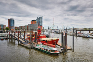 Germany, Northern Germany, port city, Hamburg, seaport, Elbe, Hamburg harbor, Überseebrücke, Elbe promenade, berth of Das Feuerschiff LV13, built 1952, end of service 1989, harbor panorama with a view of Hafencity and the landmark Elbphilharmonie Germany, Northern Germany, port city, Hamburg, seaport, Elbe, Hamburg harbor, Überseebrücke, Elbe promenade, berth of Das Feuerschiff LV13, built 1952, end of service 1989, harbor panorama with a view of Hafencity and the landmark Elbphilharmonie