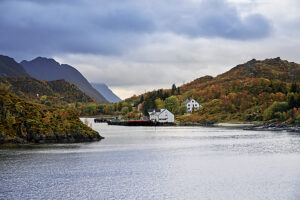 Cruise on the coast of Norway, Hanøy harbor at the entrance to Raftsundet, dark clouds
