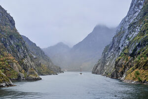Cruise along the coast of Norway, Lofoten archipelago, narrow channel in the Trollfjord, steep cliffs, fog