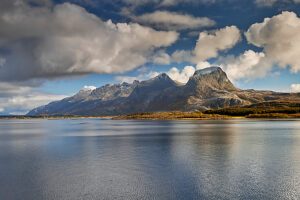 Cruise along the coast of Norway, mountain range The Seven Sisters, with mountain peaks Botnkrona, Grytfoten, Skjaeringen, Gemini, Hvastind and Stortind
