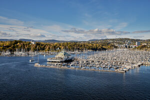 Cruise on the coast of Norway, Oslo harbor, marina with clubhouse and rowing club, Kongen Marina with pleasure boats