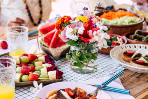 Close up of table full of seasonal fruits and vegetables for a healthy lifestyle and diet nutrition concept - coloured food on the table Close up of table full of seasonal fruits and vegetables for a healthy lifestyle and diet nutrition concept - coloured food on the table