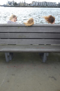 Three girls blowing the wind around their ears Three girls blowing the wind around their ears