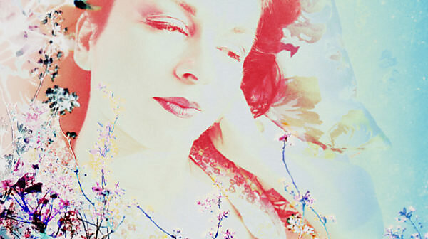 Portrait of a woman overlaid with blossoms