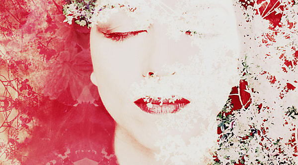 Portrait of a woman overlaid with blossoms