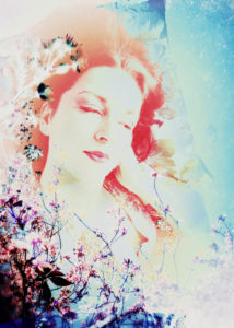 Portrait of a woman overlaid with blossoms