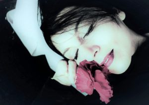Portrait of a woman, closed eyes, blossom