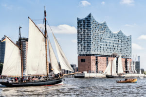 Elbphilharmonie seen from the water with sailboats