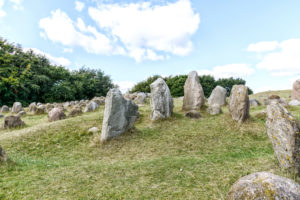 Stone tombs on green meadow near Lindholm Høje, Aalborg