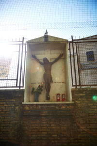Statue of Christ on the cross, wayside cross, Rome, Italy Statue of Christ on the cross, wayside cross, Rome, Italy