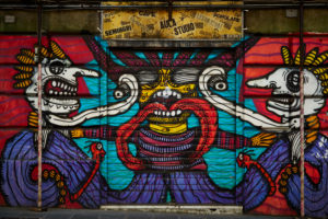Graffiti, house wall, street art, Head-on, region Liguria, Genoa, Italy Graffiti, house wall, street art, Head-on, region Liguria, Genoa, Italy