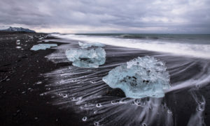 Iceland, glacial ice on the lava beach in the Jökulsarlon glacier lagoon before sunrise Iceland, glacial ice on the lava beach in the Jökulsarlon glacier lagoon before sunrise