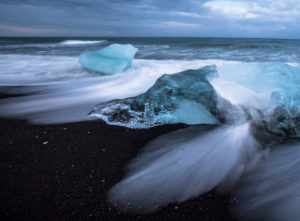 Iceland, glacial ice on the lava beach in the Jökulsarlon glacier lagoon before sunrise Iceland, glacial ice on the lava beach in the Jökulsarlon glacier lagoon before sunrise