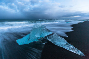 Iceland, glacial ice on the lava beach in the Jökulsarlon glacier lagoon before sunrise Iceland, glacial ice on the lava beach in the Jökulsarlon glacier lagoon before sunrise