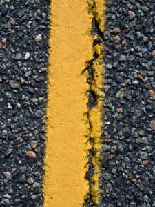 Algoma Region, Kanada, close up of the asphalt road, cracked roadway, province of Ontario, Trans-Kanada Highway Algoma Region, Kanada, close up of the asphalt road, cracked roadway, province of Ontario, Trans-Kanada Highway