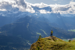 Man enjoys view from the Wank over Garmisch-Partenkirchen, view towards the Wetterstein Mountains with Alpspitze, Waxensteinen and Zugspitze, Garmisch-Partenkirchen, Upper Bavaria, Bavaria, Southern Germany, Germany Man enjoys view from the Wank over Garmisch-Partenkirchen, view towards the Wetterstein Mountains with Alpspitze, Waxensteinen and Zugspitze, Garmisch-Partenkirchen, Upper Bavaria, Bavaria, Southern Germany, Germany
