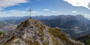 Panoramic photo from the Kramer summit with a view over Garmisch-Partenkirchen, Grainau, Karwendel Mountains and Wetterstein Mountains (with Alpspitze and Zugspitze), blue sky, clouds, rock, summit cross, Garmisch-Partenkirchen, Upper Bavaria, Bavaria, southern Germany, Germany Panoramic photo from the Kramer summit with a view over Garmisch-Partenkirchen, Grainau, Karwendel Mountains and Wetterstein Mountains (with Alpspitze and Zugspitze), blue sky, clouds, rock, summit cross, Garmisch-Partenkirchen, Upper Bavaria, Bavaria, southern Germany, Germany