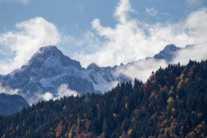Mountain peak Oberreintalschrofen in the Wetterstein Mountains, clouds, blue sky, trees, autumn, Garmisch-Partenkirchen, Upper Bavaria, Bavaria, southern Germany, Germany Mountain peak Oberreintalschrofen in the Wetterstein Mountains, clouds, blue sky, trees, autumn, Garmisch-Partenkirchen, Upper Bavaria, Bavaria, southern Germany, Germany