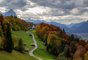 Kirchdorf Wamberg with St. Anna's Church above Garmisch-Partenkirchen in autumn, Bauernstadel, promenade, trees, clouds, Garmisch-Partenkirchen, Upper Bavaria, Bavaria, southern Germany, Germany Kirchdorf Wamberg with St. Anna's Church above Garmisch-Partenkirchen in autumn, Bauernstadel, promenade, trees, clouds, Garmisch-Partenkirchen, Upper Bavaria, Bavaria, southern Germany, Germany